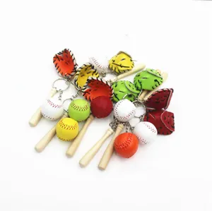 Close-up detail of colorful baseball, bat, and glove keychain set in multiple colors.