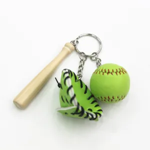 Detailed view of baseball keychain featuring a mini wooden bat green glove and ball.