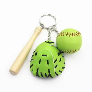 Detailed view of baseball keychain with green leather glove, ball, and wooden bat.