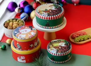 Boîte ronde en fer-blanc de Noël pour biscuits et bonbons, motif de père Noël et bonhomme.