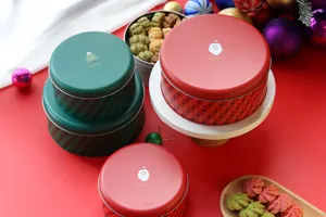 Detail de boite ronde en metal de Noel, conteneur en fer-blanc decoratif pour biscuits et bonbons.
