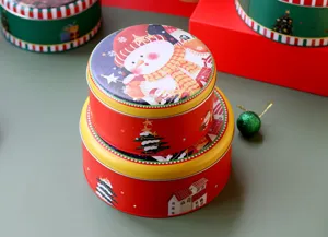 Boîte ronde en fer-blanc pour biscuits de Noël, contenant de stockage rouge et festif.