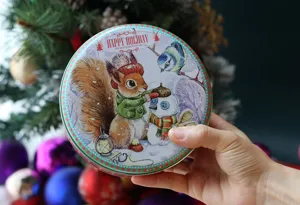 Boîte en fer-blanc ronde de Noël pour biscuits, bonbons et cadeaux avec joli écureuil et bonhomme
