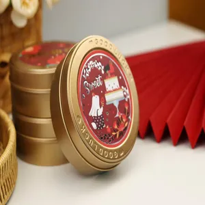 Χρυσό στρογγυλό μεταλλικό κουτί για συσκευασία δώρου καραμέλας τσαγιού γάμου λεπτομέρεια