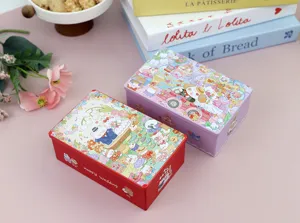 Détail de boîtes à bonbons de mariage en fer blanc avec lapins et texte Happy Wedding