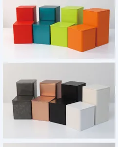 A collection of colorful square tinplate airtight tea canisters shown in tall and short sizes