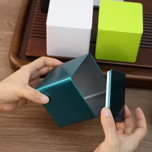 Modern square tinplate tea storage container with airtight lid, available in teal and green