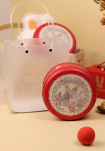 Red round metal tin box with cute wedding rabbit illustration, ideal gift packaging.