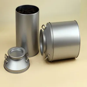 Close up of double handled metal tea tin canister detail, retro style storage container jar