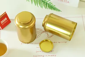 Detail view of the elegant gold tinplate tea canister, featuring a moisture-proof finish.