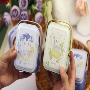 Boîte en fer blanc portable avec adorable lapin, idéale pour cadeaux et bonbons.