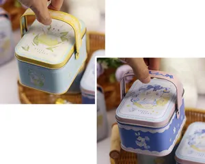Boîte cadeau en fer-blanc portable avec illustration de lapin et poignée pour les bonbons.