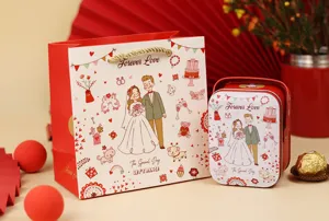 Vue détaillée du sac cadeau de mariage rouge et de la boîte à bonbons avec joli couple de dessins.