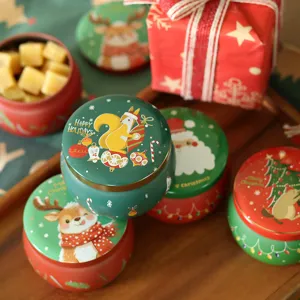 Boîte en métal cylindrique de Noël, pot de stockage de bonbons et emballage cadeau festif.