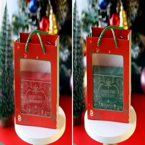 Sac cadeau de Noël avec boîte en fer blanc rectangulaire, idéal pour biscuits et friandises.