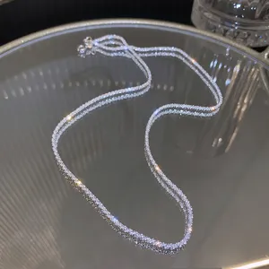 Macro view of a sparkling silver clavicle chain with shimmering starlight effects