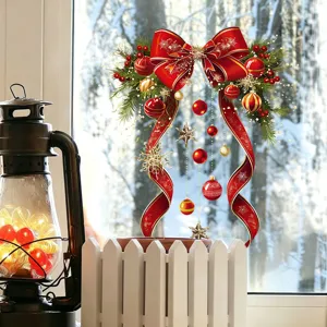 Festive Christmas window sticker featuring a red bow and gold ornaments in a cozy room setting.