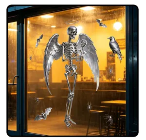 Detailed view of 3D silver skeleton angel wings Halloween window cling on a glass pane