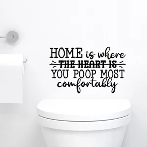 Funny bathroom wall decal with a humorous quote applied on a white wall above a toilet