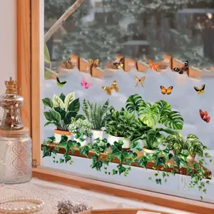 Detailed view of green plant and butterfly static glass stickers applied on a window pane