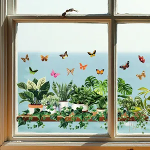 Vibrant green plant and butterfly static window stickers on a clear glass pane.