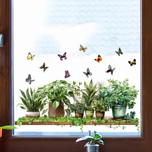 Detail view of vivid green potted plants and colorful butterfly static cling window stickers