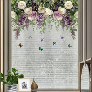 Detail view of colorful butterfly and floral vine stickers on a window glass pane