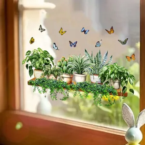 Detailed view of butterfly and potted plant electrostatic window stickers on a glass pane
