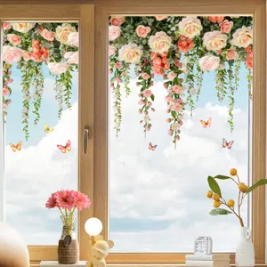 Detail view of double-sided floral and butterfly window stickers on a bright glass pane.
