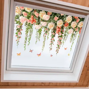 Decorative floral and butterfly window decals applied on a bright ceiling skylight glass