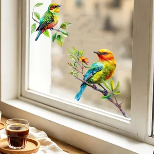 Detail view of colorful watercolor bird window stickers in a cozy home setting