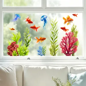 Detail of vibrant goldfish and jellyfish static window stickers on a clear glass window