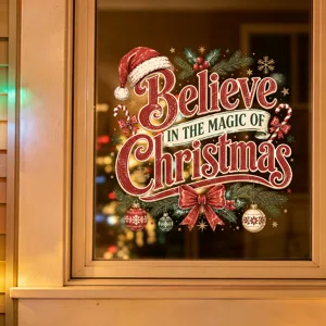 Close-up of Christmas window sticker with 'Believe in the Magic' quote and festive ornaments