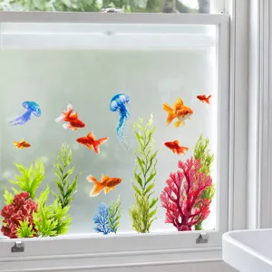 Detailed view of colorful fish and seaweed static window clings applied to glass.