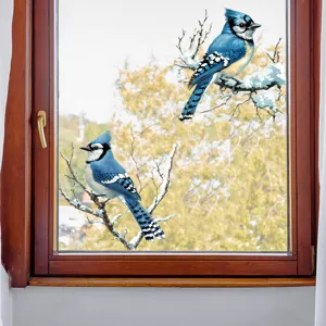 Close-up detail of realistic blue jay window stickers on a glass pane