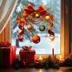 Close-up of festive Christmas window sticker featuring red bow and colorful ornaments on glass