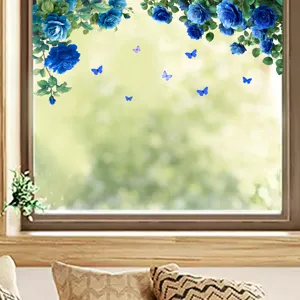 Vibrant blue roses and fluttering butterflies static window stickers on bright glass pane