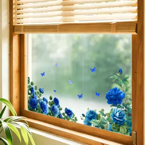 Detailed view of blue rose and butterfly static window stickers on a glass surface