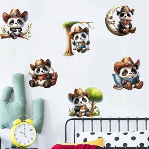 Diverse cute cowboy panda wall stickers displayed on a cozy bedroom wall.