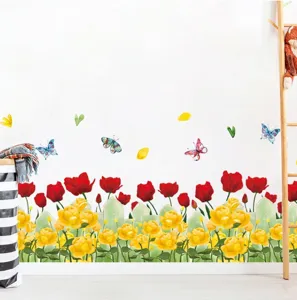 Vibrant tulip and rose baseboard wall sticker applied to a clean white bedroom wall