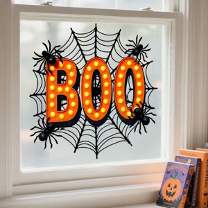 Halloween window sticker featuring orange BOO marquee lights and spiders in a web