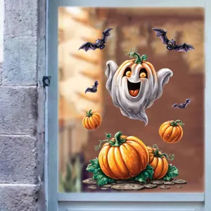 Autocollants colorés d'Halloween avec fantôme et citrouille sur une fenêtre en verre
