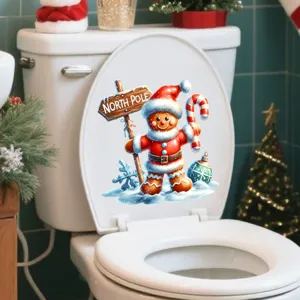 Sticker imperméable de bonhomme pain d'épices de Noël sur un abattant de WC blanc