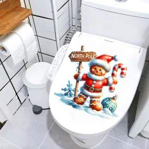 Autocollant de bonhomme de pain d'épices étanche sur couvercle de toilette blanc.