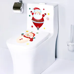 Detail of Christmas toilet stickers showing Santa and snowman designs on white toilet