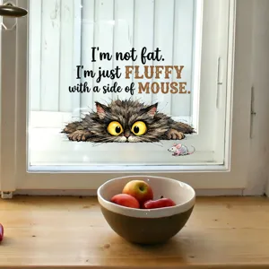 Close-up detail of a funny cat and mouse window sticker with 'I'm not fat' text quote.