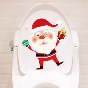 Macro view of a creative Santa Claus sticker applied to a white toilet lid cover