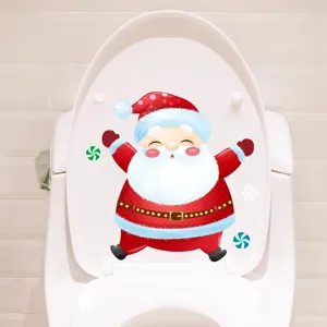 Detailed view of waterproof Santa Claus Christmas sticker on a white toilet lid.