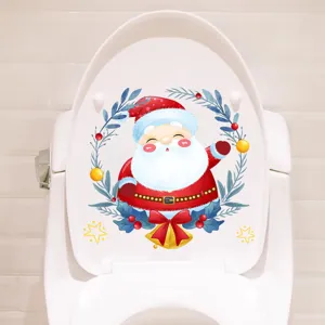 Waterproof festive Christmas Santa Claus toilet lid sticker on a white toilet lid