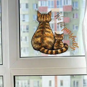 Decorative window sticker featuring two striped cats and the text We fit purrfectly